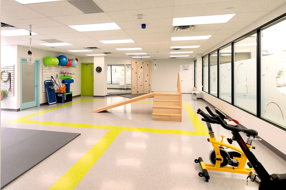 A bright clinic space with kid-friendly colours and equipment